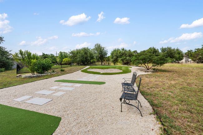 Par 3 golf hole with 9 tee boxes. | Image 35