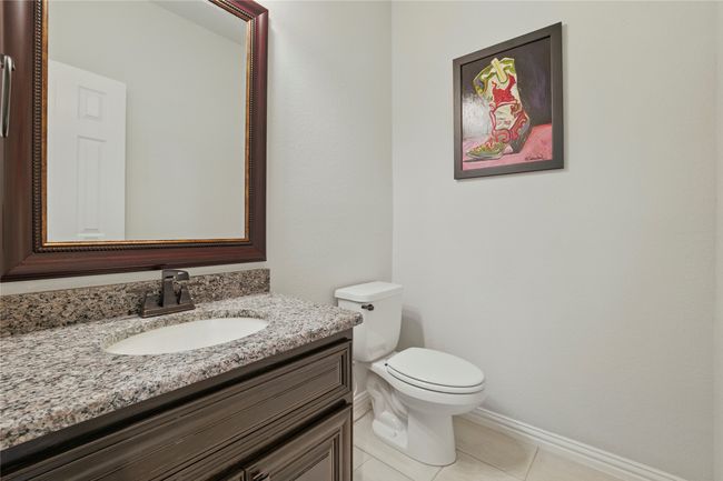 Half bathroom with vanity and tile patterned floors | Image 6