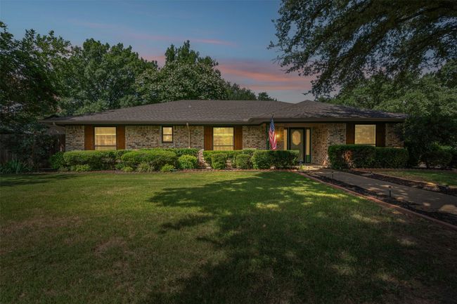 Ranch-style home with a front yard | Image 34