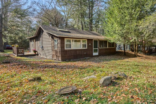 View of side of property with a wooden deck | Image 12