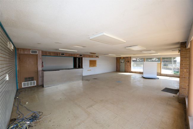 Garage featuring wooden walls | Image 17
