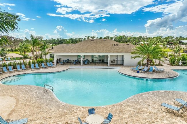 View of swimming pool with a patio area | Image 18