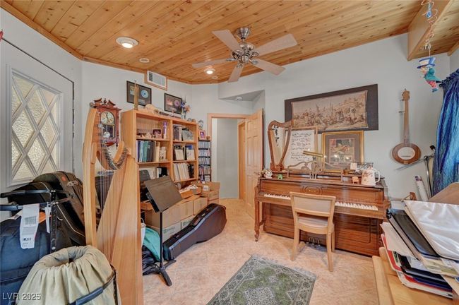 Living area featuring wood ceiling, tile patterned flooring, a ceiling fan, and recessed lighting | Image 48