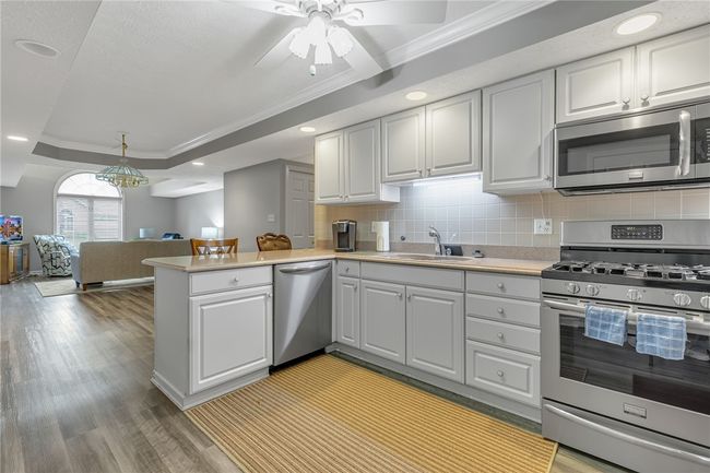 What a great picture this is to show you the lay out of the home. Notice the bar area you where can have your casual meals. Dining area just behind you. | Image 7