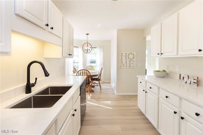 The crisp white kitchen provides room to add your own touches! | Image 15
