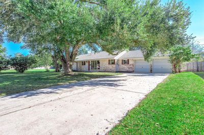 Double Wide Driveway, excellent curb appeal. Mature trees with natural shade :) | Image 2