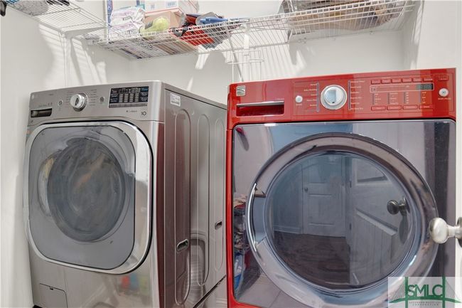 Laundry room with additional shelving | Image 37