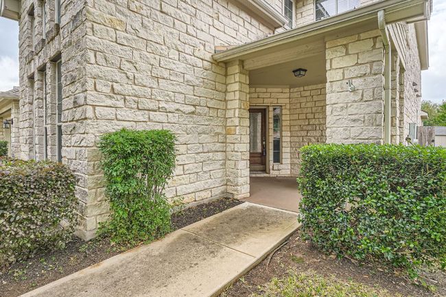 View of exterior entry with stone siding | Image 4