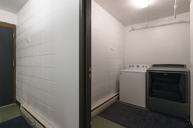 Laundry room with independent washer and dryer and a baseboard heating unit | Image 41