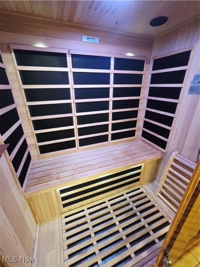 Sauna featuring wood walls and wooden ceiling | Image 24