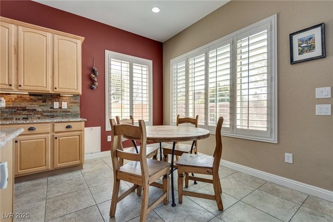 Dining room with baseboards, a wealth of natural light, and light tile patterned flooring | Image 27