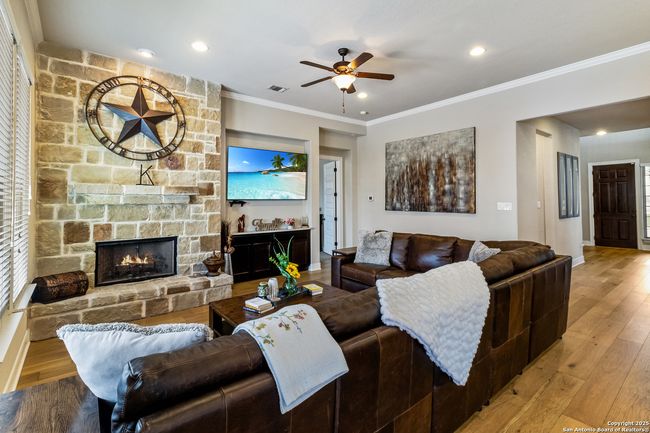 A bright and inviting living room with large windo | Image 50