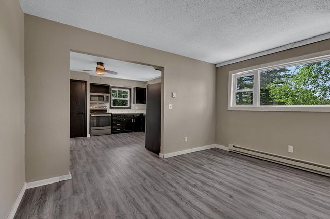 Dining room has large opening creating a defined space, yet open concept feel | Image 10