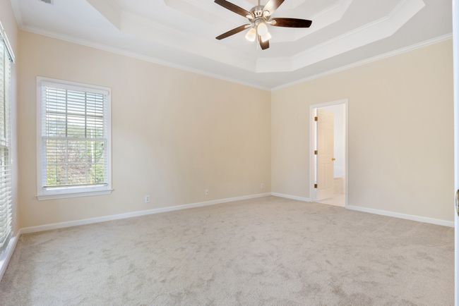 Primary bedroom is separated from other bedrooms for privacy in the owners retreat | Image 15