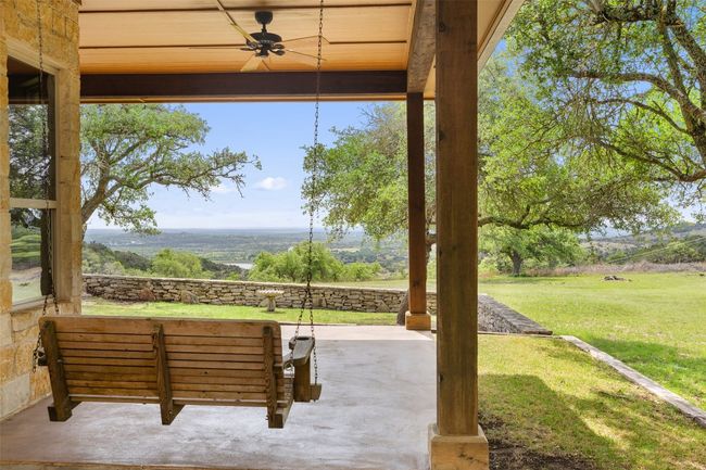 View of patio / terrace with a ceiling fan | Image 5