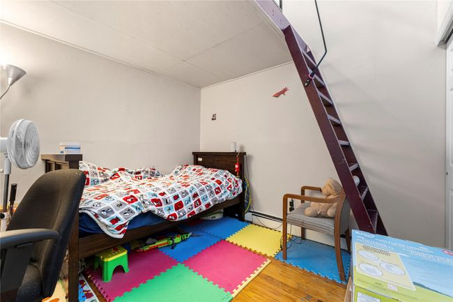 Bedroom featuring wood finished floors | Image 11