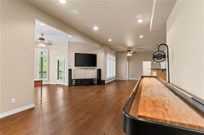 Game room with recessed lighting, ceiling fan, wood finished floors, and baseboards | Image 36