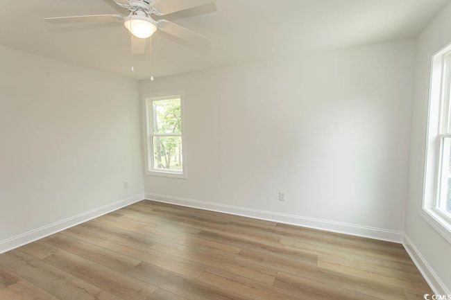 Unfurnished room with light wood finished floors, plenty of natural light, and baseboards | Image 18