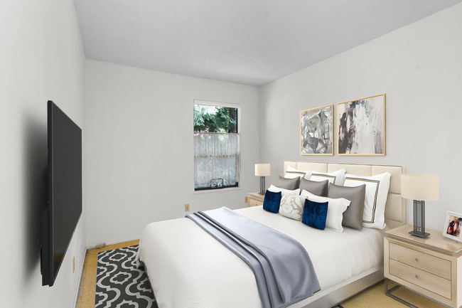Bedroom featuring light carpet and baseboards | Image 25