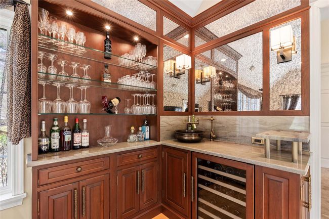 Wet bar with a wine cooler. Designed by Mel Eilon | Image 11