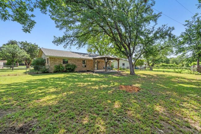 Note the gorgeous mature trees and flat lot perfect for adding your own playscape, swimming pool and more! | Image 36