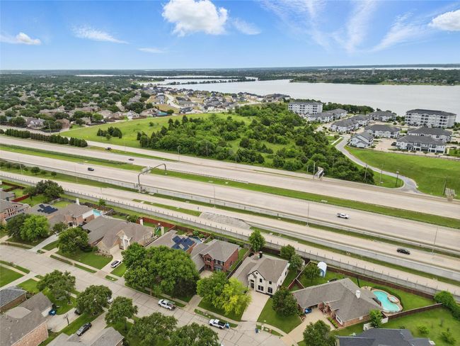 Aerial perspective of suburban area with a nearby body of water | Image 37