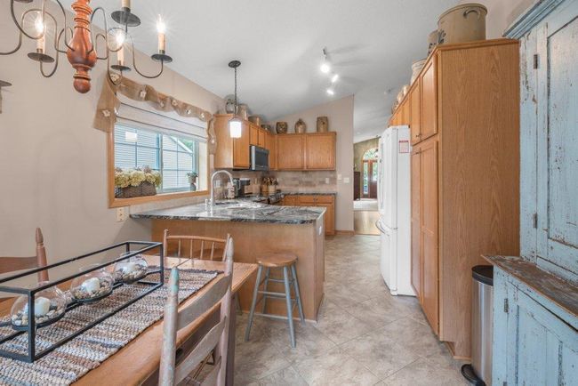 The kitchen window enhances the space and brightens the room - you can truly enjoy all the real wood and character throughout the property. | Image 7