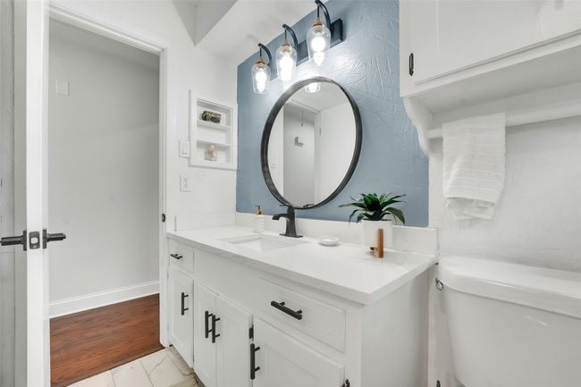Bathroom featuring vanity and toilet | Image 30