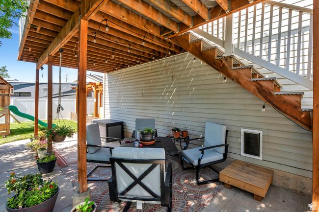 View of patio / terrace with a playground, stairway, and an outdoor living space | Image 23