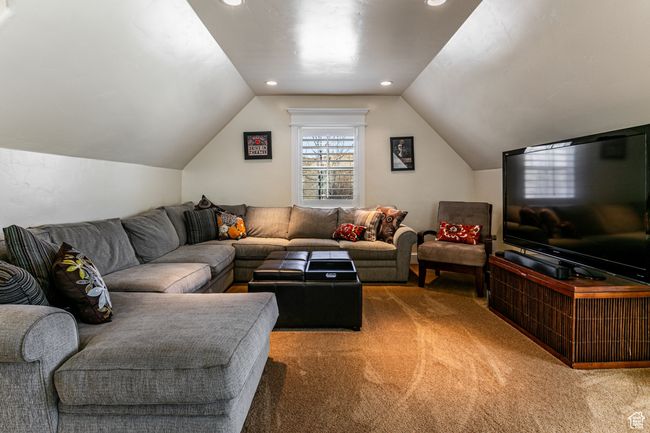 Living room with lofted ceiling, recessed lighting, and carpet | Image 23
