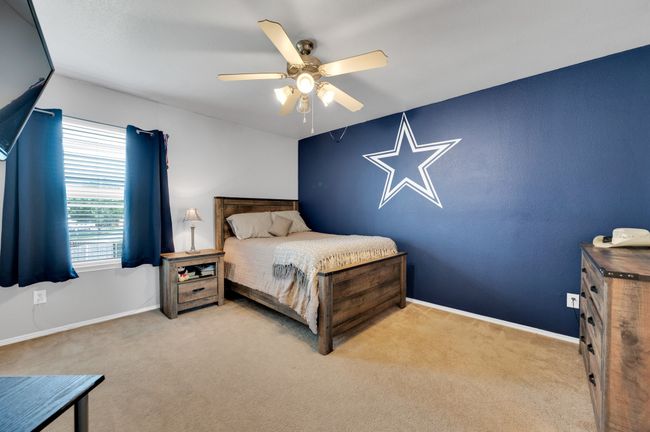 Bedroom with carpet floors and a ceiling fan | Image 27