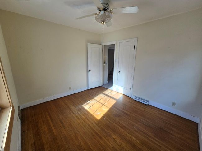 SE bedroom with hardwood flooring | Image 15