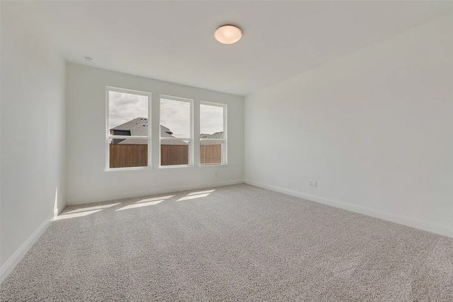 Empty room featuring carpet and baseboards | Image 9
