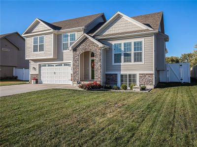 View of front of house with a front yard and a garage | Image 2