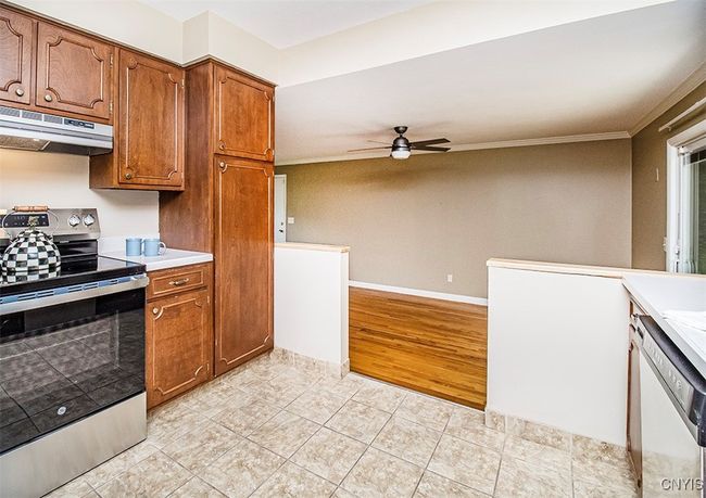 A kitchen overlooking the family room keeps everyone together... | Image 18