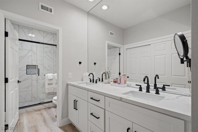 The redesigned master retreat offers a spa-inspired bathroom with dual sinks, a walk-in shower, & beautiful finishes. STUNNING! | Image 24