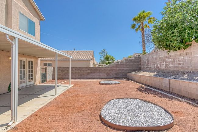 Fenced backyard with french doors and a patio area | Image 32