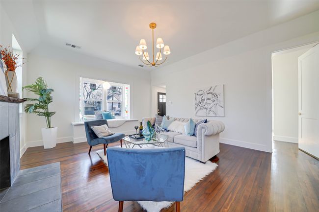 Living room featuring dark hardwood / wood-style flooring and a​​‌​​​​‌​​‌‌​‌‌​​​‌‌​​‌‌​‌​​​​​‌ chandelier | Image 10