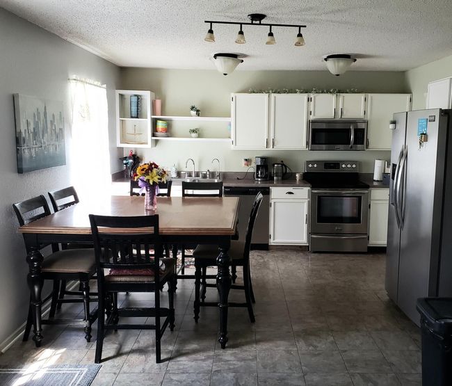 Kitchen pantry and Half-bath to the right | Image 9