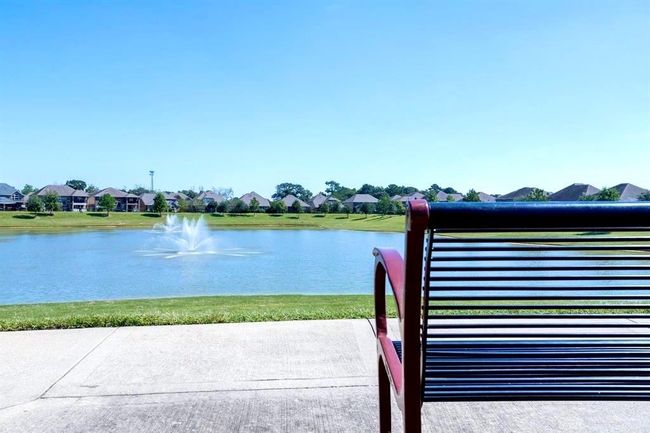 The community lake with walking trails and sitting benches to relax and enjoy the tranquil scenery. | Image 39
