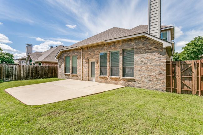 Manageable backyard offers plenty of grass for pets and play. | Image 25