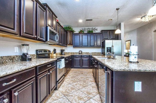 8864 Candy Palm Road, House other with 6 bedrooms, 5 bathrooms and null parking in Kissimmee FL | Image 8