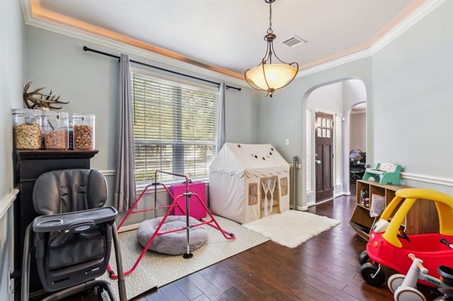 Thru the front door to the right is the dining room with accent lighting at ceiling. | Image 18