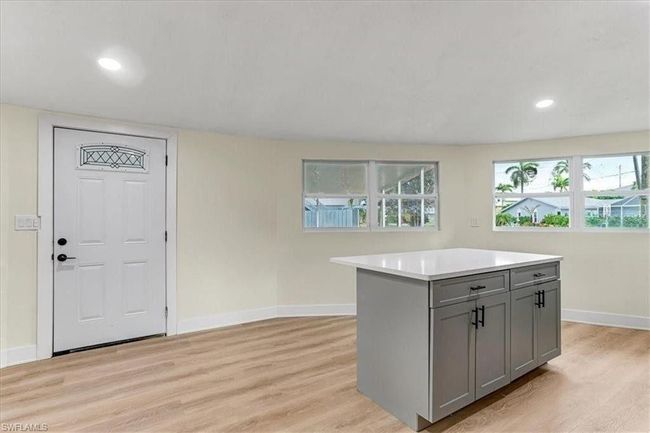 Kitchen looking to front door - Living area Unfurnished - Virtually edited | Image 17