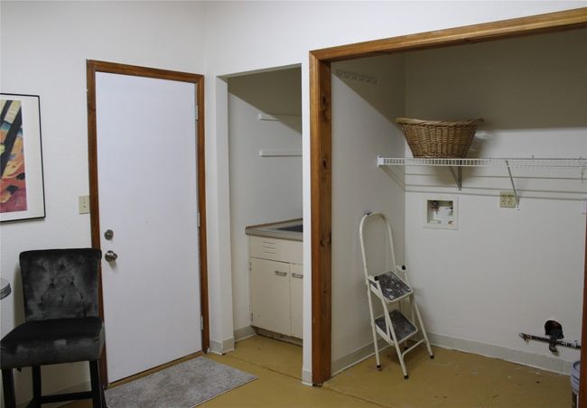 Laundry area featuring hookup for a washing machine and baseboards | Image 12
