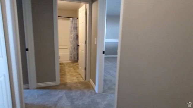 Hall featuring carpet flooring and baseboards | Image 61