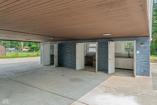 garage featuring a carport and a sink | Image 45