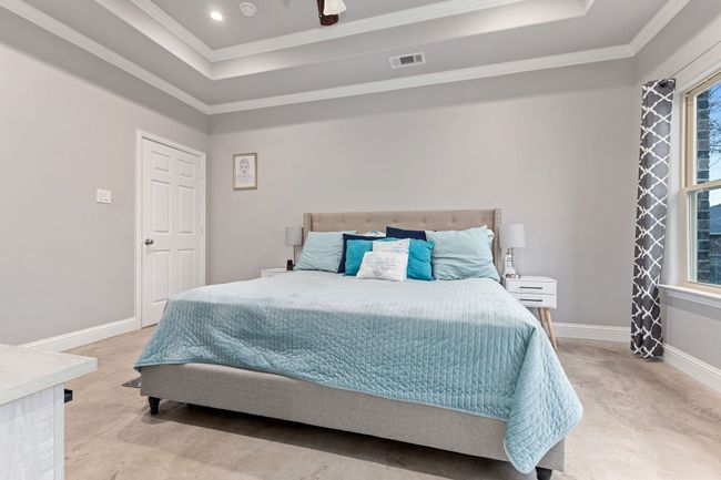 Bedroom featuring ornamental molding and a raised ceiling | Image 17