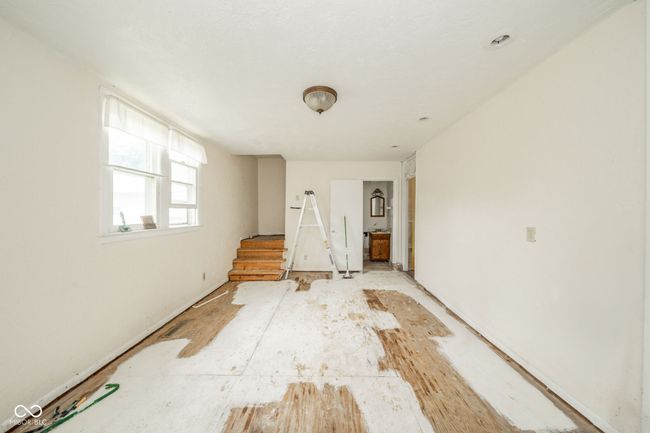 Half Bathroom located at end of family room. Back Stairway to bathroom/laundry | Image 11