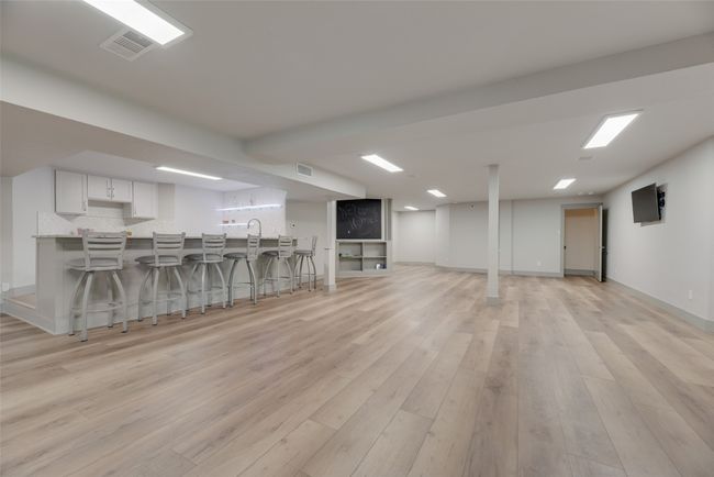 Endless possibilities for this basement space with dual staircases on each end. | Image 22